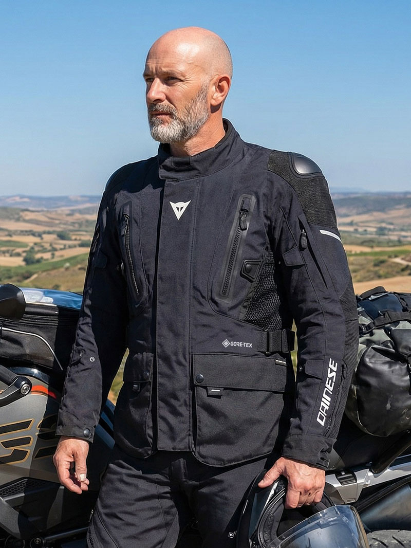 Guy wearing black Dainese Carve Master 4 GTX suit